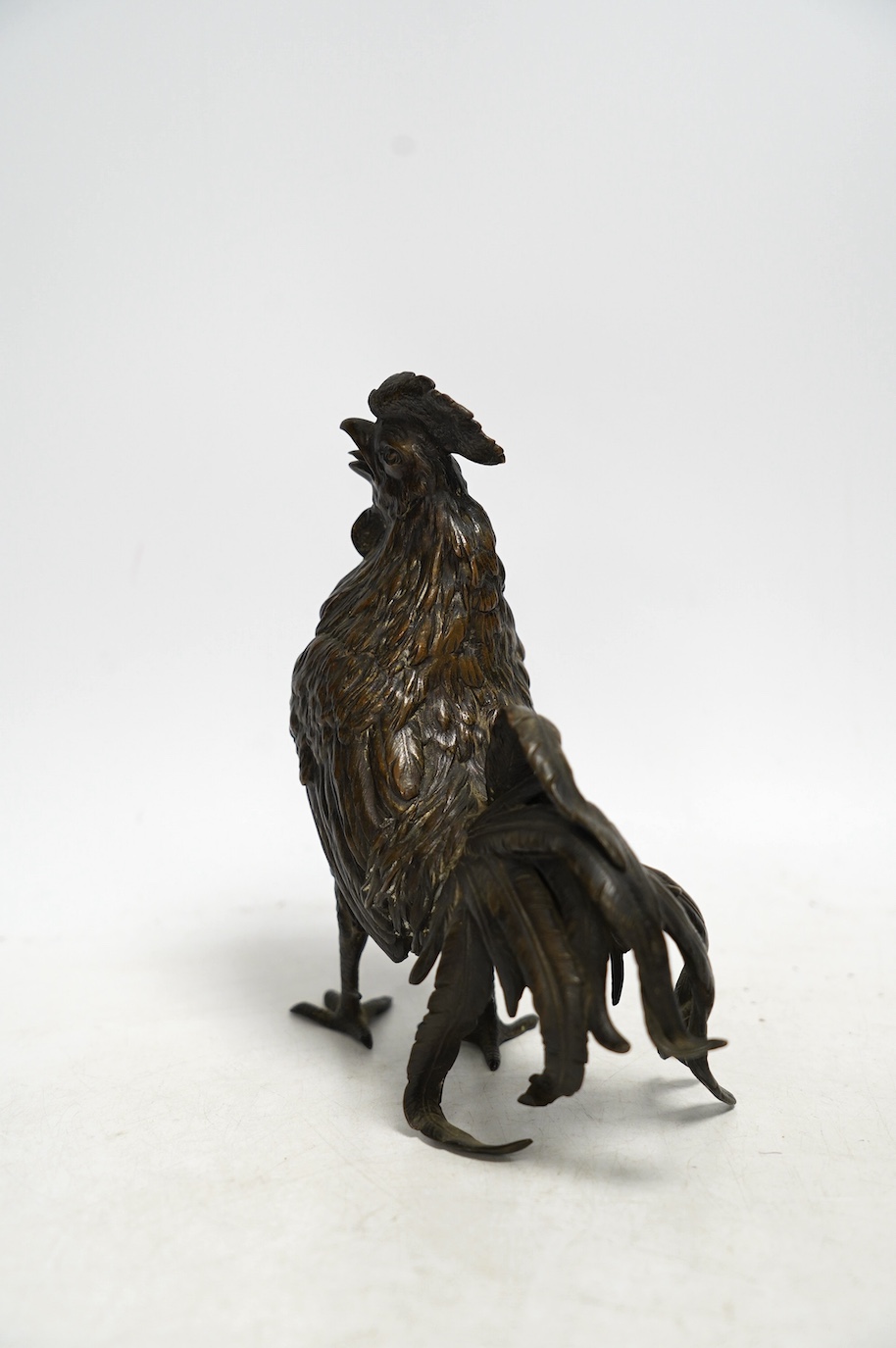 A bronze study of a cockerel, 17cm. Condition - good